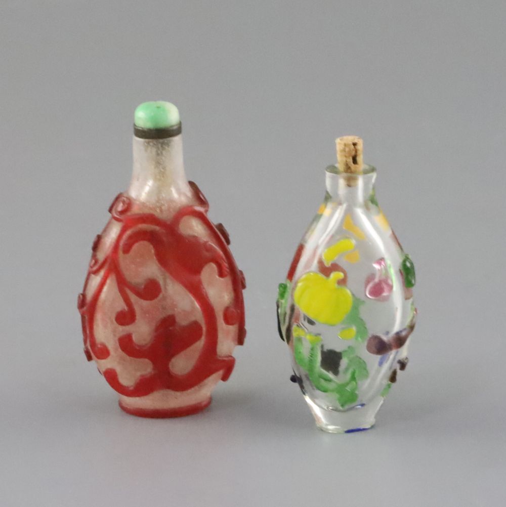 A Chinese six colour overlaid glass snuff bottle and a red overlaid snowflake ground glass snuff bottle,